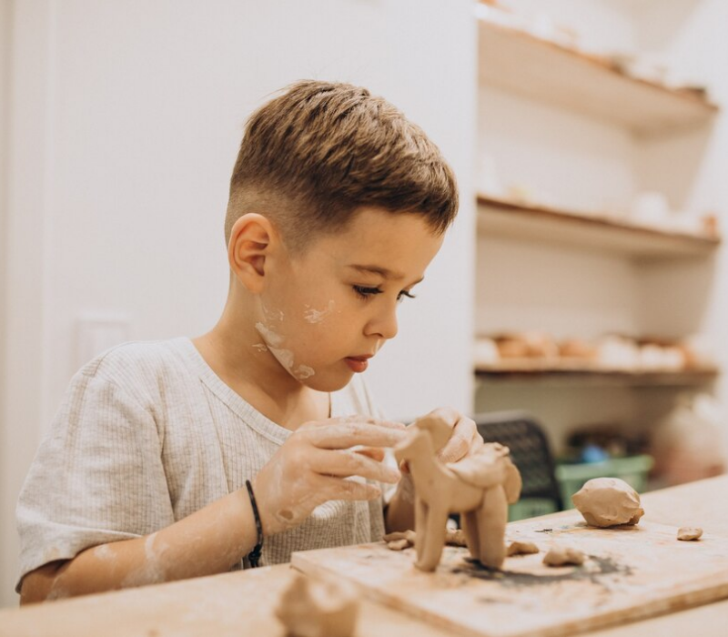 cute-boy-forming-toys-from-clay_1303-24696 boy